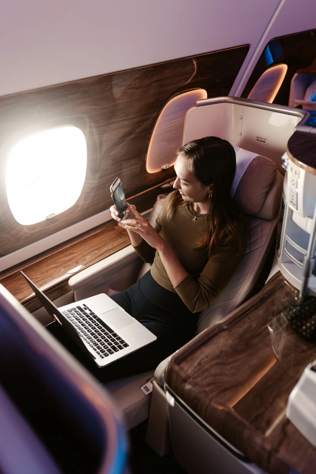Traveler relaxing in a spacious premium aircraft cabin
